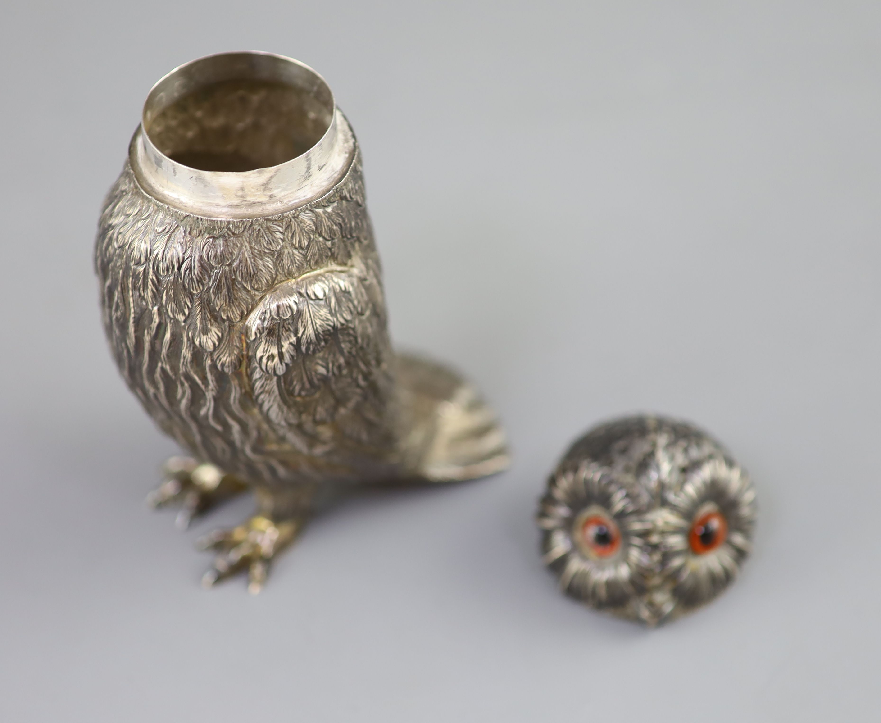 A Victorian silver owl sugar sifter, having chased feather decoration and removable head inset glass eyes,